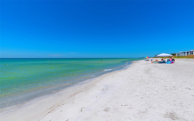 property view of water featuring a beach view