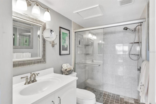 full bath featuring a stall shower, visible vents, vanity, and toilet