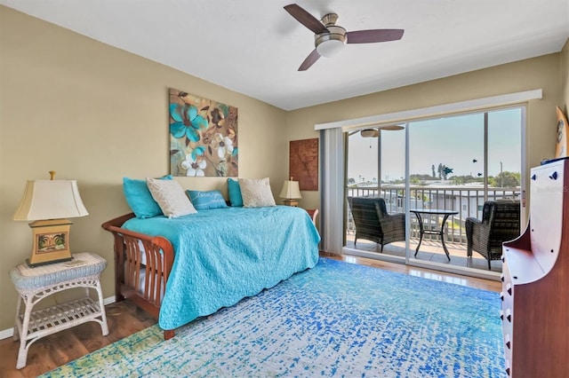 bedroom with a ceiling fan, access to outside, baseboards, and wood finished floors