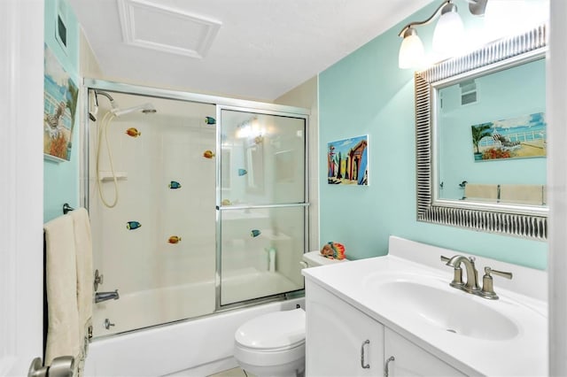 full bath featuring toilet, visible vents, bath / shower combo with glass door, and vanity