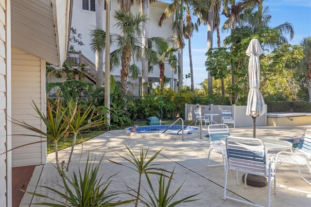 view of patio with a community pool