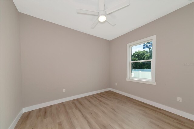 unfurnished room with ceiling fan and light hardwood / wood-style floors