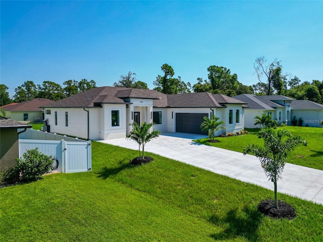 view of front facade featuring a garage and a front yard