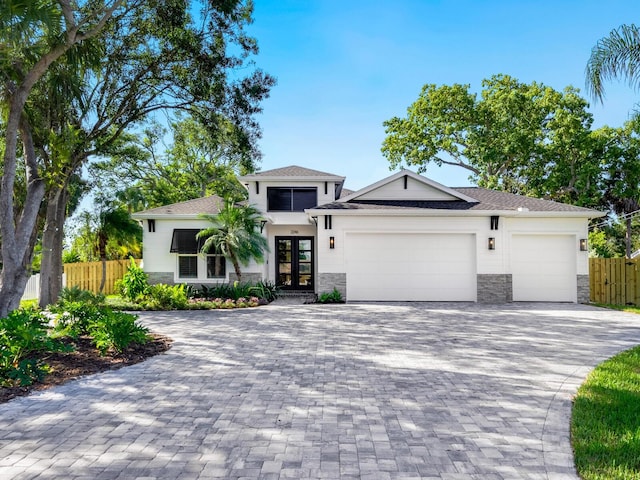 view of front of house featuring a garage and french doors