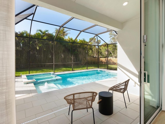 view of swimming pool with a lanai, an in ground hot tub, and a patio