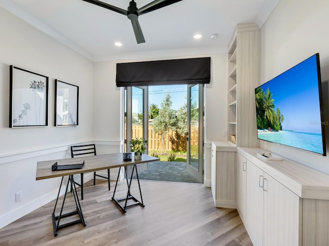 office area featuring ceiling fan, ornamental molding, and light hardwood / wood-style flooring