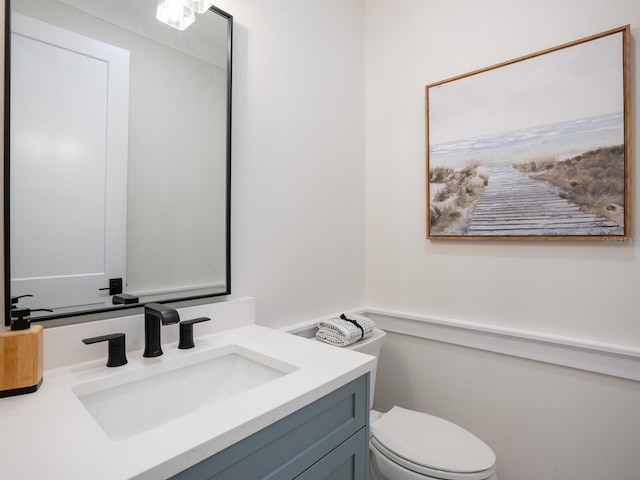 bathroom with vanity and toilet