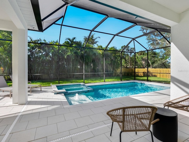 view of swimming pool with glass enclosure, an in ground hot tub, and a patio