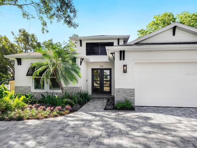 view of front of home featuring a garage and french doors