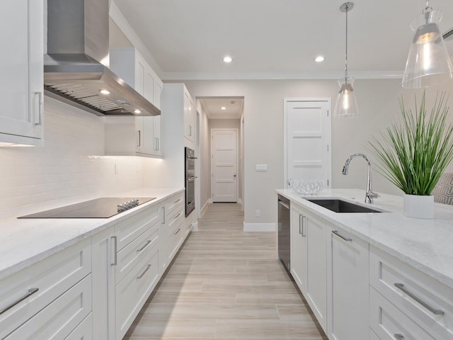 kitchen with exhaust hood, white cabinetry, black electric stovetop, sink, and light stone counters