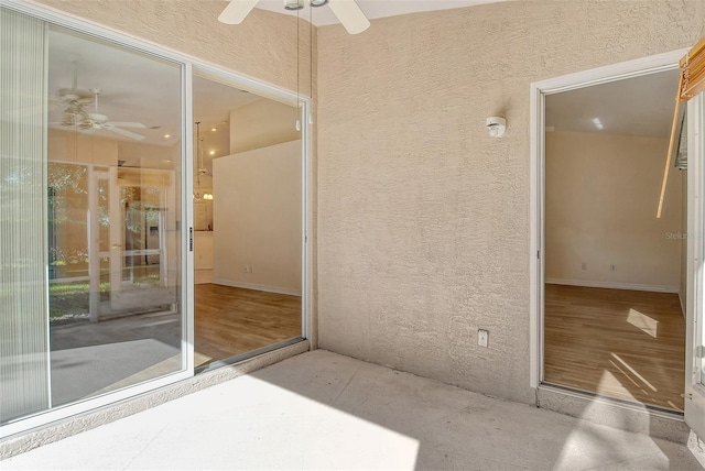 interior space with a patio area and ceiling fan