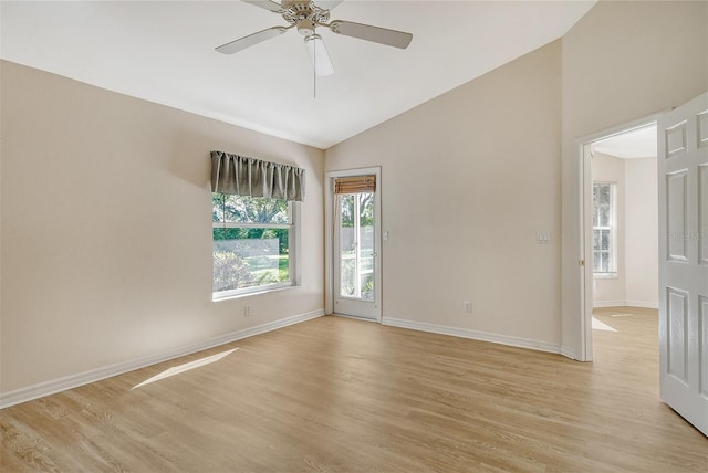 unfurnished room with light wood-type flooring, baseboards, a ceiling fan, and lofted ceiling