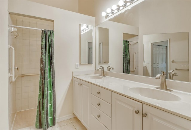 bathroom featuring tile patterned flooring, a sink, and double vanity