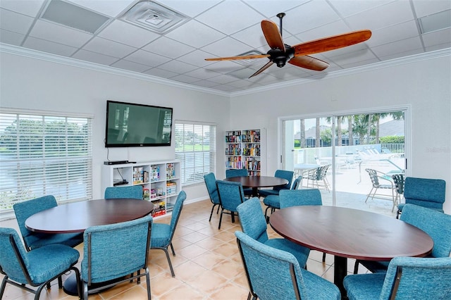 dining area featuring light tile patterned floors, a ceiling fan, visible vents, and crown molding