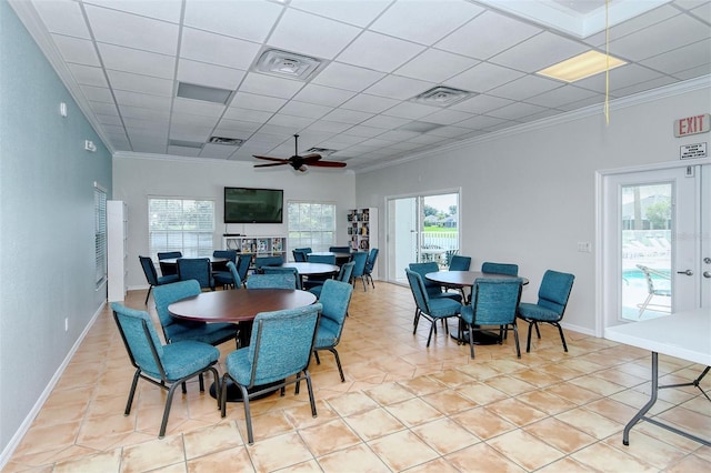 dining area with visible vents, a drop ceiling, and crown molding