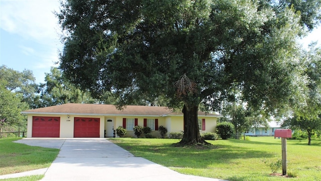 ranch-style house with a front lawn and a garage