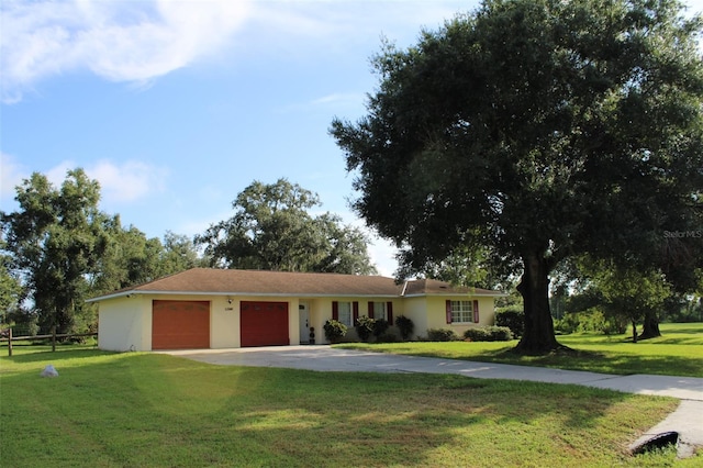 single story home with a front lawn and a garage