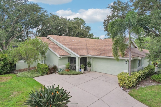 ranch-style home featuring a garage