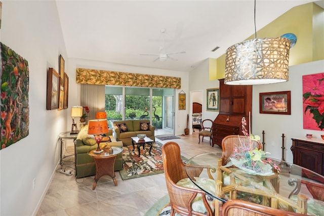 dining area with high vaulted ceiling, visible vents, ceiling fan, and baseboards