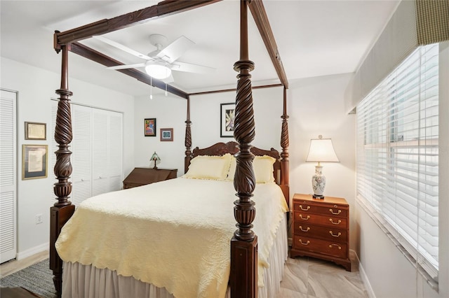 bedroom featuring ceiling fan and baseboards