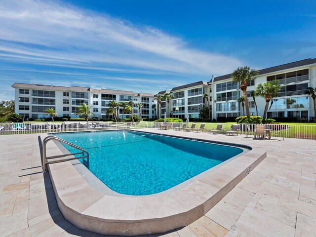 view of swimming pool with a patio area