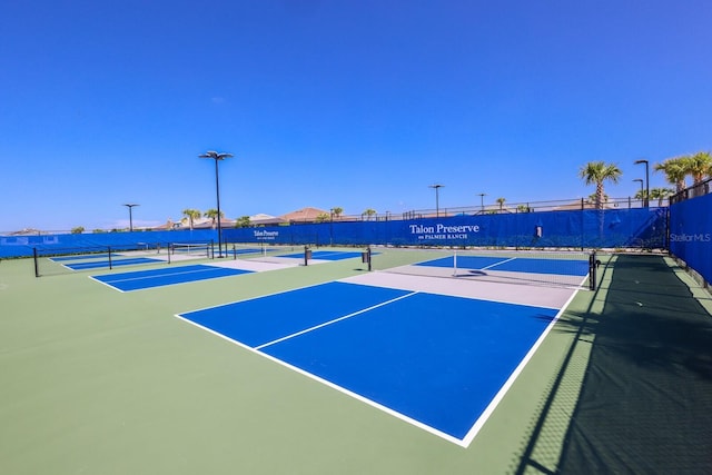 view of sport court featuring basketball hoop