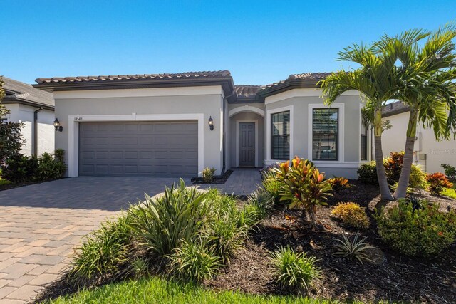 mediterranean / spanish house with a garage