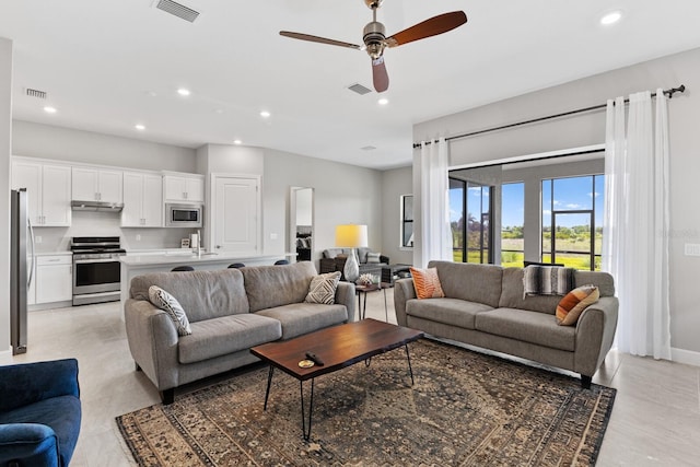 living room featuring ceiling fan