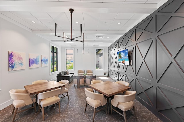 dining space featuring a drop ceiling