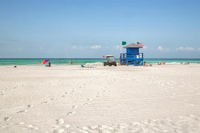 property view of water featuring a beach view