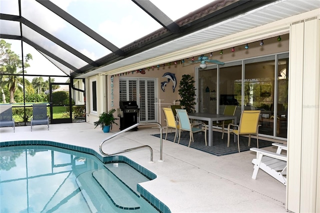 view of pool with a grill, a lanai, a patio, and ceiling fan