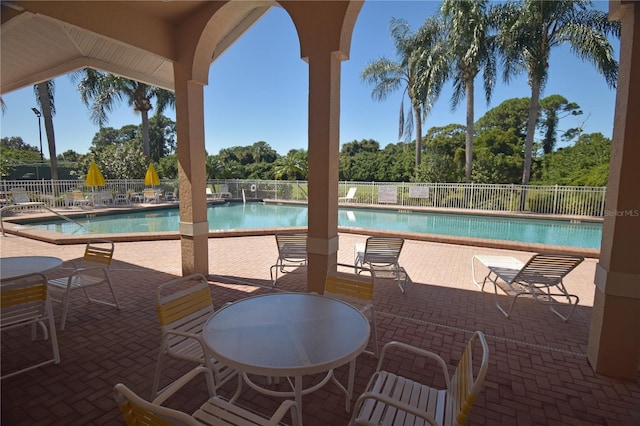 view of swimming pool with a patio