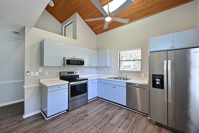 kitchen featuring ceiling fan, hardwood / wood-style flooring, appliances with stainless steel finishes, and wood ceiling