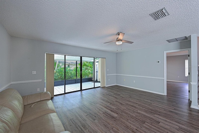 unfurnished living room with ceiling fan, a textured ceiling, and dark hardwood / wood-style floors