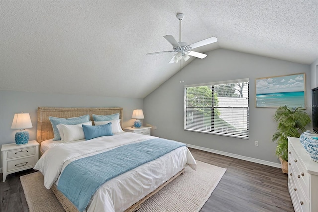 bedroom featuring ceiling fan, vaulted ceiling, hardwood / wood-style floors, and a textured ceiling