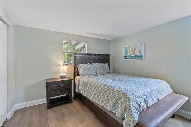 bedroom with light wood-type flooring