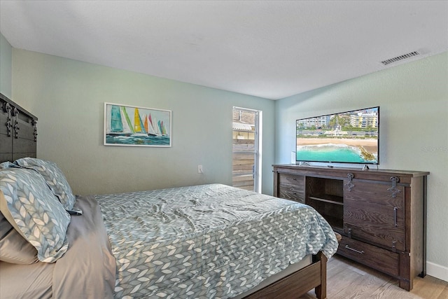 bedroom with light wood-type flooring