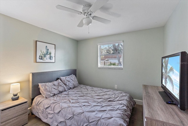 bedroom featuring hardwood / wood-style floors and ceiling fan