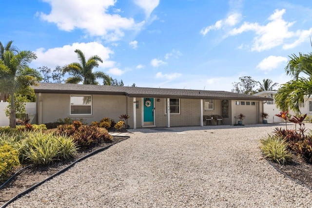 single story home featuring a garage