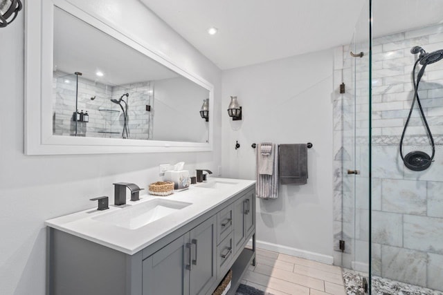 bathroom with vanity and an enclosed shower