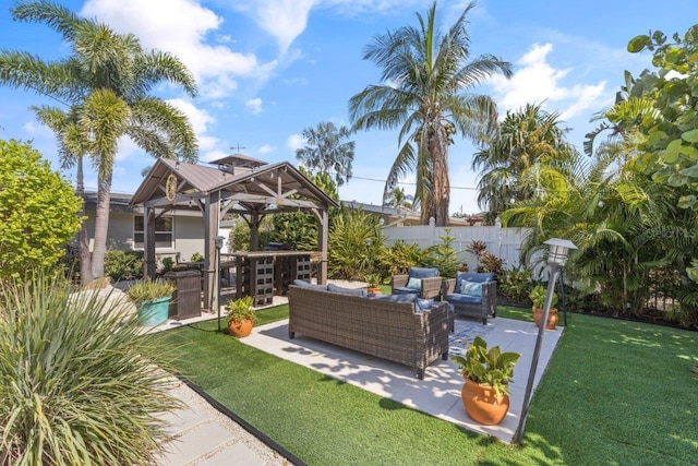 view of yard featuring a gazebo, a patio area, and an outdoor hangout area