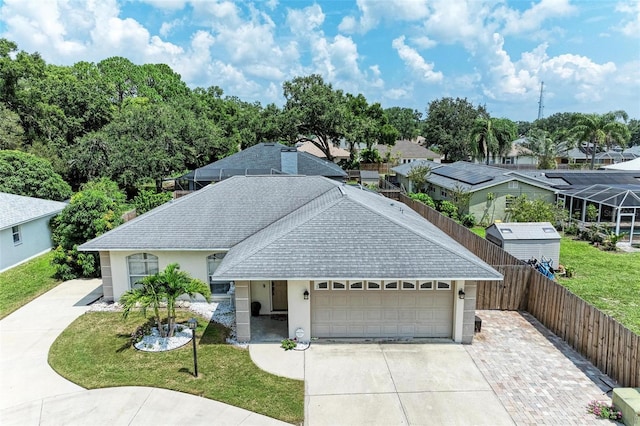 view of front facade featuring a front yard and a garage