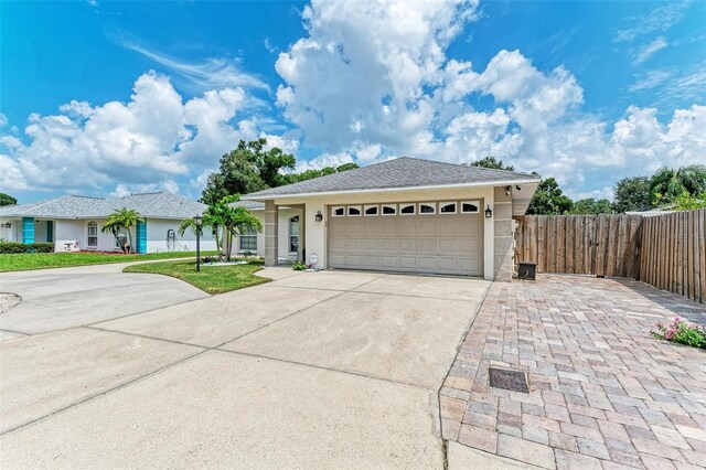 single story home featuring a garage