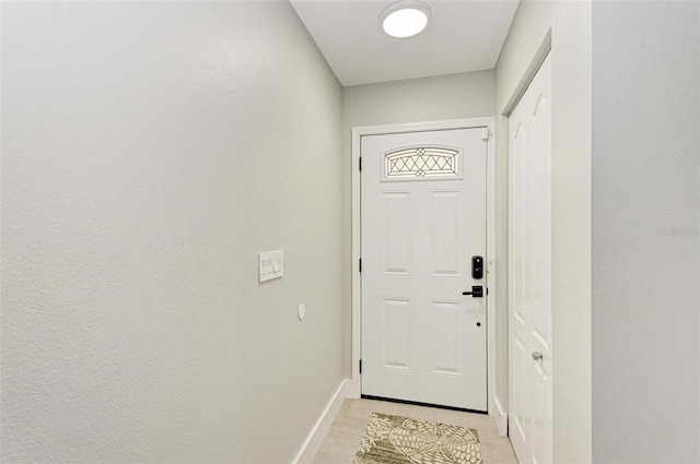 entryway with light tile patterned floors