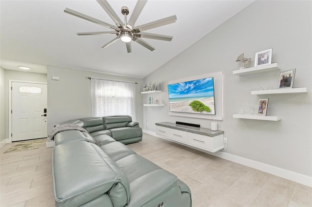 living room featuring ceiling fan and lofted ceiling