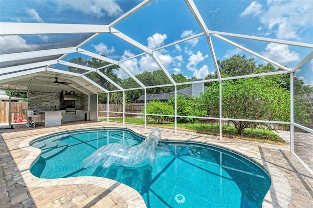 view of swimming pool with a patio, area for grilling, and ceiling fan