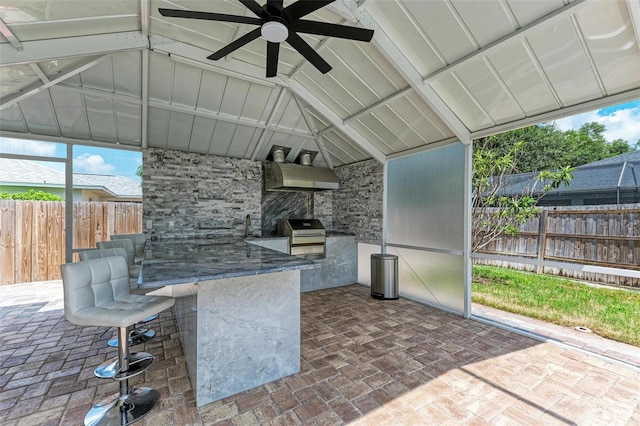 view of patio / terrace featuring an outdoor kitchen, ceiling fan, and a grill