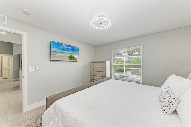 bedroom with light tile patterned flooring