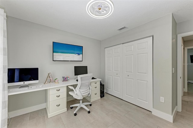 office featuring a textured ceiling