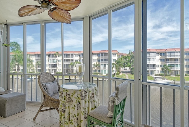 sunroom with plenty of natural light and ceiling fan